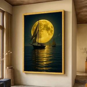 May include: A framed art print depicts sailboats on the ocean under a large, yellow full moon. The water reflects the moon's light, creating a golden glow. The artwork is framed in a gold-colored frame.