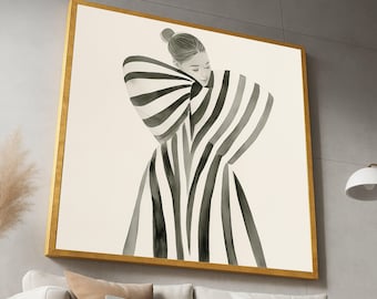 May include: A framed art print featuring a watercolor illustration of a person in a black and white striped garment. The artwork is set against a cream background and framed in a gold-colored frame. The image is displayed on a wall above a sofa.