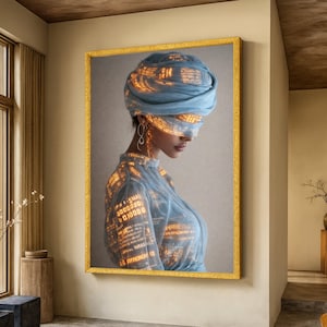 May include: A framed digital art print depicting a woman in a blue head wrap and dress, with glowing code patterns. The artwork has a gold frame and is displayed on a beige wall.