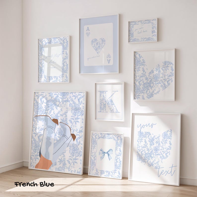 May include: A collection of framed art prints in various sizes, featuring a French blue floral pattern. The prints include playing card designs, a heart, a letter "K", and a pair of boots. The text "French Blue" is at the bottom.