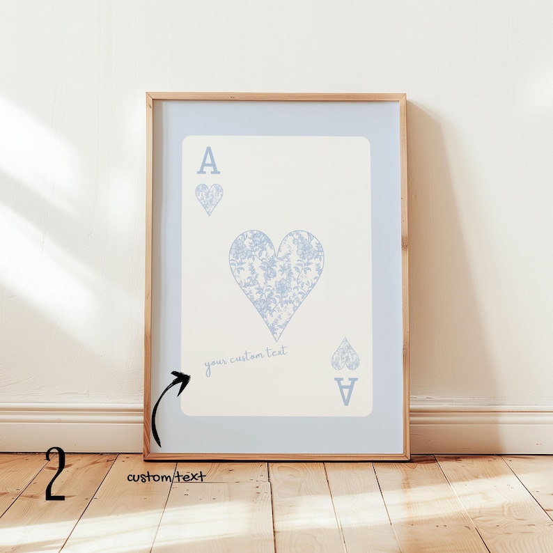 May include: Framed art print featuring the Ace of Hearts playing card design. The card has a light blue border and a cream-colored center. The heart symbol is filled with a floral pattern. The text "your custom text" is below the heart.