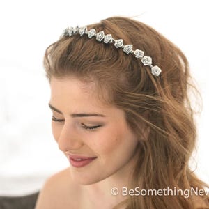 tiny ribbon roses in this flower crown have been painted heavily with metallic paint, making them almost appear to me made from metal. On each end of this hair wreath are wire loops so you can pin it in your hair. The headband is light weight and so easy to add to any hair style.