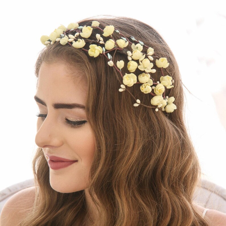 flower crown from beautiful vintage flowers in a pretty shade of yellow. I added them to some ivory pips on wire to create this special headband. It is thicker on one side to create an asymmetrical look.