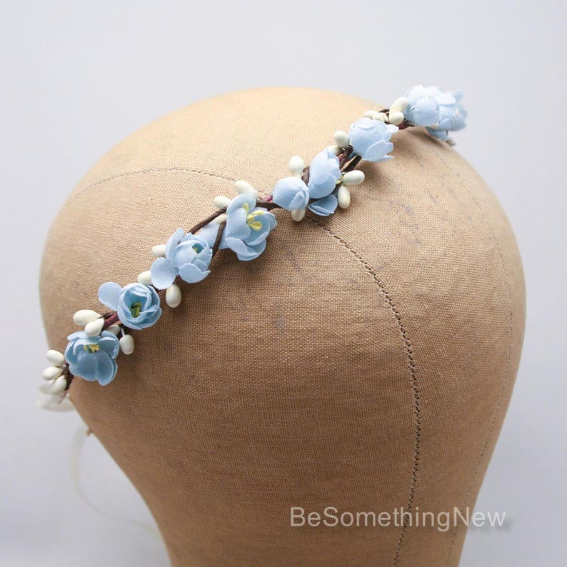 flower crown from beautiful vintage flowers in a pretty shade of Baby Blue. I added them to some ivory pips on wire to create this special headband. It ties in the back with long narrow satin ribbons, and will bend to fit any size from a child to adult