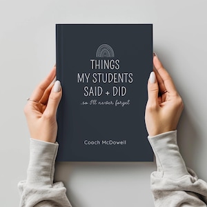 May include: A dark blue journal with the text "Things My Students Said + Did...so I'll never forget" and "Coach McDowell". The journal has a rainbow design on the cover.