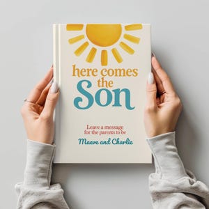 May include: A cream-colored book with the text "here comes the Son" in orange and teal. A watercolor sun illustration is at the top. The text "Leave a message for the parents to be Maeve and Charlie" is at the bottom.