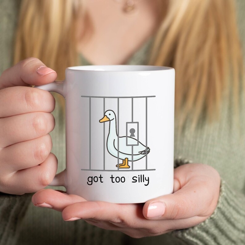 Person holding Got Too Silly Goose Mug