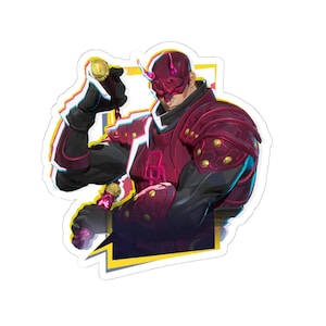 May include: A sticker featuring a character in a red and black armored suit and mask, holding a golden weapon. The character has a red mask with horns and is set against a yellow and white background.