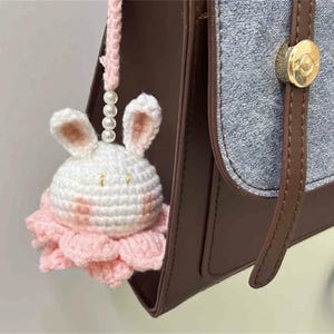 Hand-woven crochet doll keychain bag pendant.