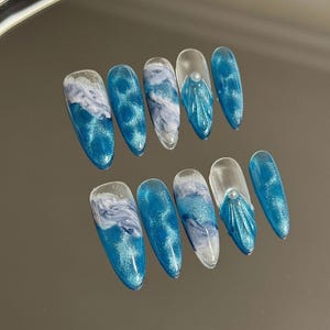 Ocean Wave-Inspired Blue Press-On Nails with Glitter Accents