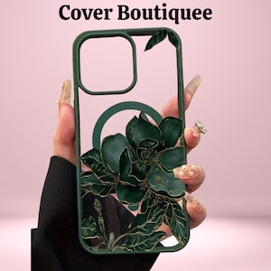May include: A dark green phone case with a clear back, featuring a large, three-dimensional floral design with gold accents. The case has a cutout for the camera and the text "Cover Boutiquee" at the top.