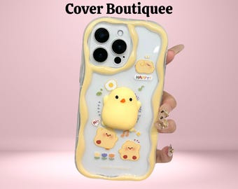 May include: A clear phone case with a yellow wavy border and a cartoon chick design. The case features a 3D yellow chick, two smaller chicks, and the word "HAPPY!" in a white rectangle. The text "Cover Boutiquee" is at the top.