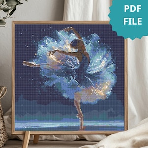 May include: A framed cross-stitch pattern of a ballerina in a blue tutu, set against a dark blue starry background. The image has a teal PDF FILE label. The ballerina is in a graceful pose, with arms outstretched.
