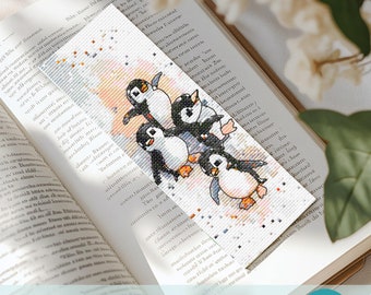 May include: Cross stitch pattern featuring a group of five penguins in a playful pose. The penguins are white with black accents and are surrounded by a light blue and pink background with white stars. The pattern is designed for a bookmark.