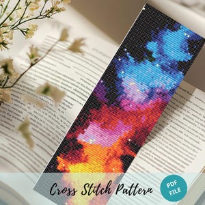 May include: Cross stitch pattern for a colorful abstract design with shades of blue, purple, pink, orange, yellow, and red. The pattern is on a black background. The text "Cross Stitch Pattern" and "PDF FILE" is at the bottom of the image.