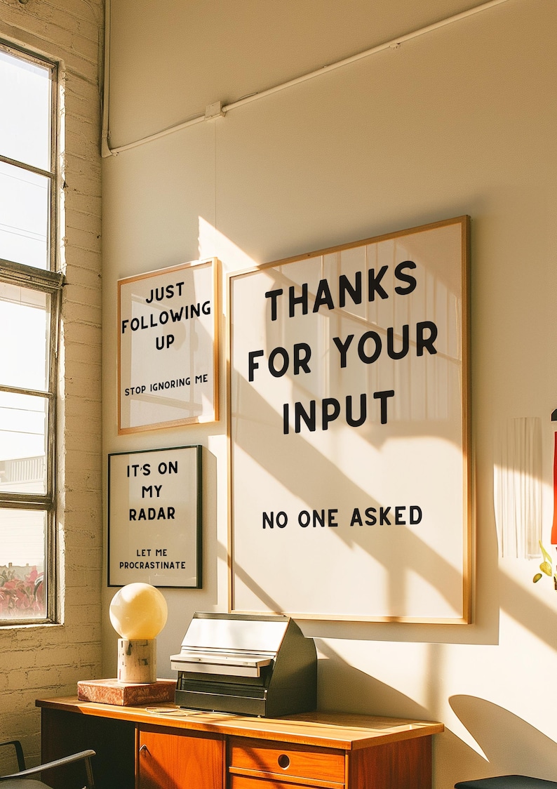 A set of four minimalist black-and-white digital art prints featuring sarcastic translations of common corporate phrases. Lets Touch Base I Need Something From You, Just Following Up Stop Ignoring Me, Its On My Radar Let Me Procrastinate, and Thanks For Your Input No One Asked. Perfect for office decor, work-from-home spaces, or as a gift for coworkers who appreciate workplace humor.