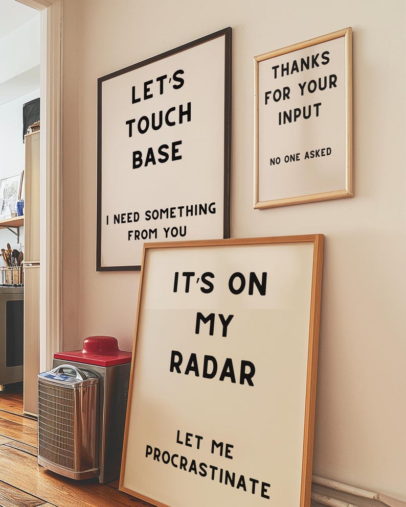 A set of four minimalist black-and-white digital art prints featuring sarcastic translations of common corporate phrases. Lets Touch Base I Need Something From You, Just Following Up Stop Ignoring Me, Its On My Radar Let Me Procrastinate, and Thanks For Your Input No One Asked. Perfect for office decor, work-from-home spaces, or as a gift for coworkers who appreciate workplace humor.