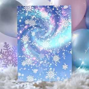 May include: A blue and white winter-themed greeting card featuring a swirling galaxy design with snowflakes. The card has a light blue background with white snowflakes and a spiral of blue, pink, and purple hues.
