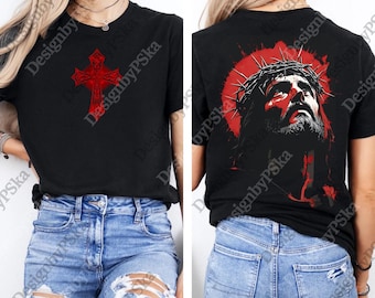 May include: Black t-shirt featuring a red cross design on the front and a red image of Jesus wearing a crown of thorns on the back. The shirt is paired with blue jeans with distressed details.