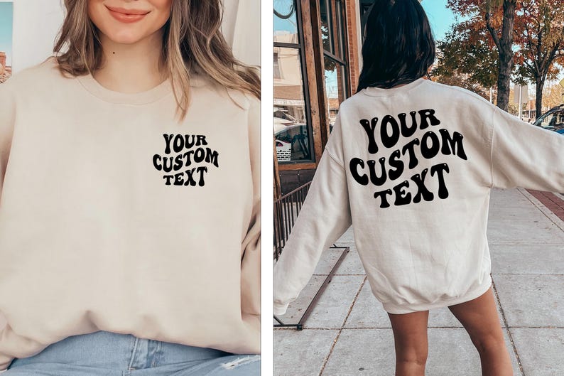 May include: A cream-colored sweatshirt with the text "YOUR CUSTOM TEXT" in black, retro-style lettering. The sweatshirt is shown on a model wearing it both front and back.