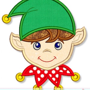 May include: An embroidered applique of an elf's face with a green hat, brown hair, and a red and white polka dot collar. The elf has blue eyes and a smiling mouth.