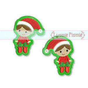 May include: Two embroidered Christmas elf designs with red hats, green pants, and brown hair. The elves are sitting with their legs crossed.