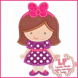 May include: Embroidered design of a girl with brown hair wearing a purple dress with white polka dots and a pink bow. The design is outlined in brown and has a pink ribbon around the waist.