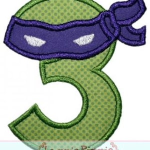 May include: Green number three with a purple ninja mask and headband. The number is outlined in green and has a green polka dot pattern.