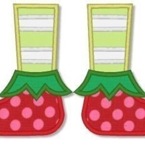 May include: A pair of whimsical elf shoes with red, polka-dotted uppers and curled toes. The shoes have green cuffs and striped green and white legs, perfect for holiday decor or crafts.