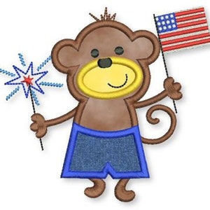 May include: A brown monkey wearing blue denim shorts holds a red, white, and blue sparkler in one hand and a small American flag in the other.
