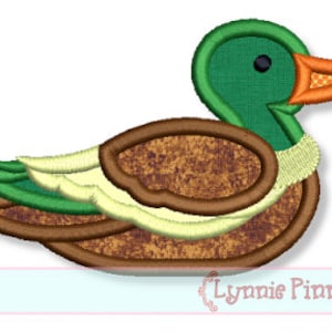 May include: A green and brown embroidered applique of a duck. The duck has a green head and a brown body with a white and yellow wing.