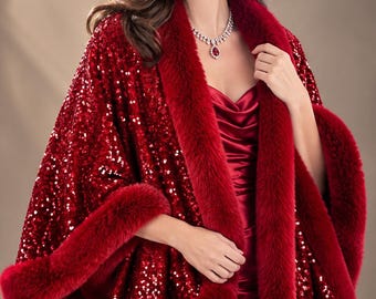 May include: A deep red sequined cape featuring a thick, plush faux fur trim along the collar and hem. The cape is worn over a matching red satin dress, complemented by a silver-toned necklace with a red pendant and matching drop earrings.