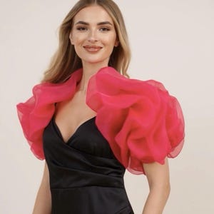 May include: A set of three ceramic mugs with a speckled, matte finish. The mugs are in shades of cream, light gray, and dark gray. Each mug has a simple, minimalist design and a rounded handle.