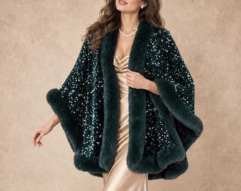 May include: A dark emerald green cape featuring dense, shimmering sequins across the entire surface. The garment is trimmed with thick, plush dark green faux fur along the front opening, the neckline, and the wide hemline of the sleeves.