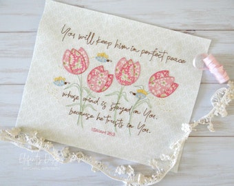 Puede incluir: Obra de arte bordada con un diseño floral con tulipanes rosas y mariposas. La obra incluye el texto "You will keep him in perfect peace whose mind is stayed on You. because he trusts in You. ISAIAH 26:3"