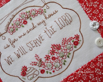 May include: White fabric with red and green embroidery of flowers and a bee. The fabric has a brown embroidered sign with the text "JOSHUA 24:15 as for me and my house WE WILL SERVE THE LORD".
