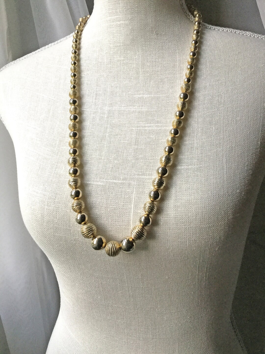 Vintage Graduated Gold Bead Necklace on a Gold Tone Chain 30 Inches