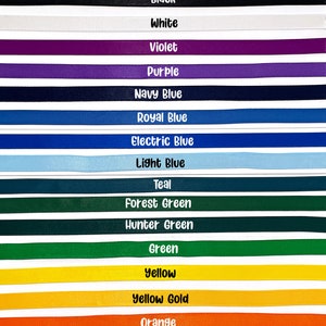 May include: A vibrant display of ribbons in various colors, each labeled with its name. Colors include brown, silver, gold, black, white, violet, purple, navy blue, royal blue, electric blue, light blue, teal, forest green, hunter green, green, yellow, yellow gold, orange, burgundy/wine, brick red/maroon, and red.