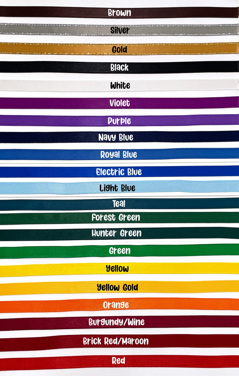 May include: A vibrant display of ribbons in various colors, each labeled with its name. Colors include brown, silver, gold, black, white, violet, purple, navy blue, royal blue, electric blue, light blue, teal, forest green, hunter green, green, yellow, yellow gold, orange, burgundy/wine, brick red/maroon, and red.