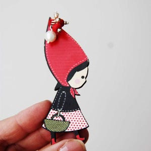Red riding hood wooden brooch, wooden brooch of red riding hood in profile with long, red hood, black vest and basket, girls teens brooch