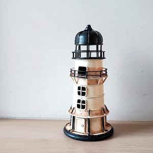 Metal lighthouse miniature, round lighthouse figure in black and beige white, beach house decor lighthouse figurine
