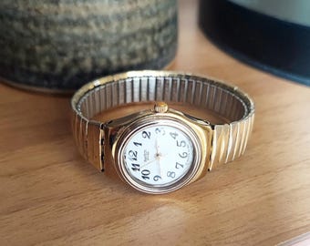 Reloj de pulsera vintage para mujer, reloj Swatch vintage con correa elástica, moderno, reloj de pulsera de cuarzo dorado.