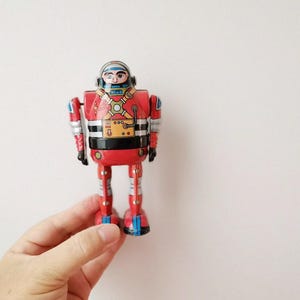 Astronaut wind up toy, collectible astronaut robot toy, tin wind up, chinese toy of astronaut in red uniform