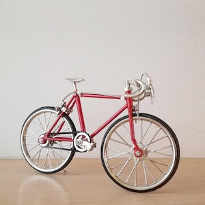 Red racing bike miniature, vintage collectible toy, red bicycle figurine, movable parts bicycle, racing bike miniature in scarlet