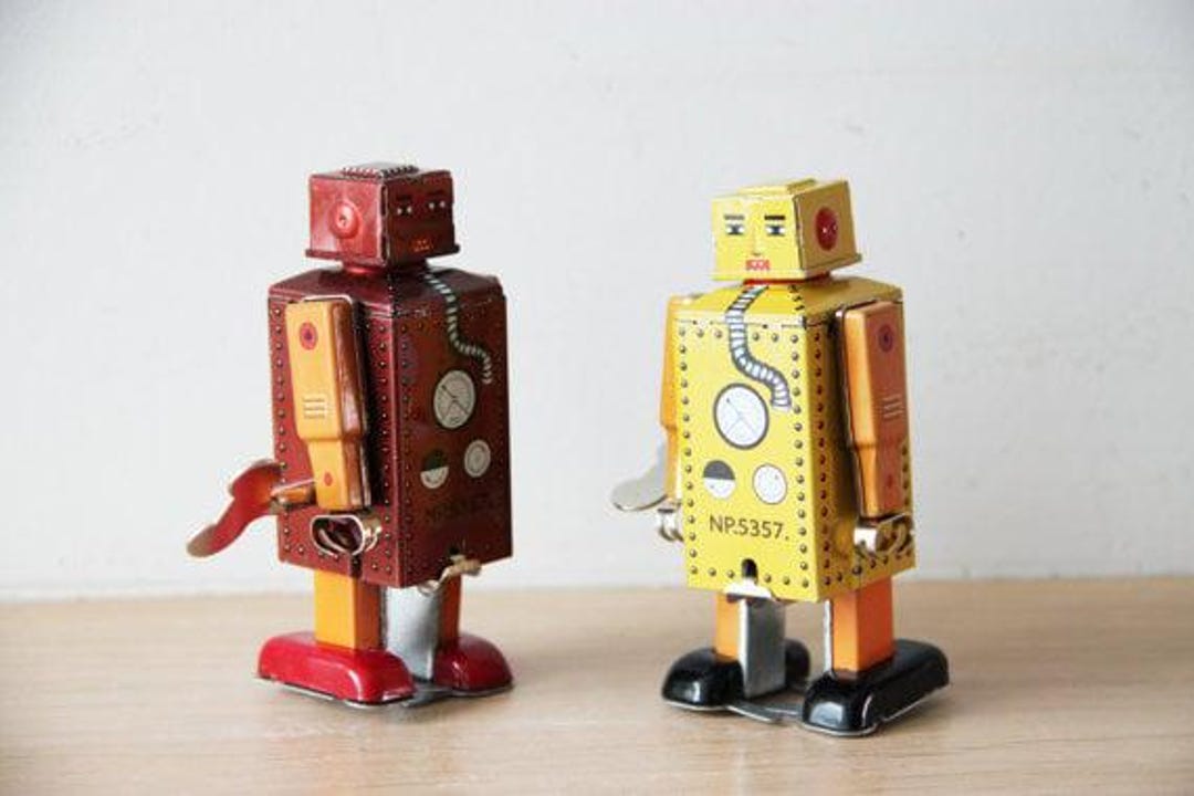 ビンテージロボット玩具、ブリキ製ゼンマイ式ロボット玩具、黄色い