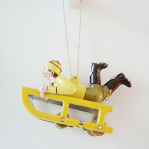 Yellow sled tree ornament, christmas tree ornament, vintage tree ornament with child in winter clothes, collectible sled miniature
