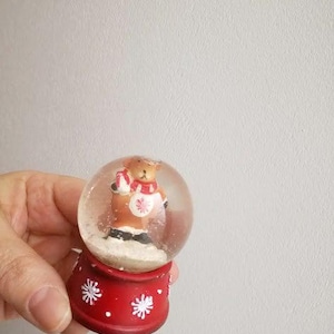 Vintage snow globe, teddy bear snowglobe with santa hat and scarf, teddy in snowglobe, xmas collectible teddy bear snowglobe on red base