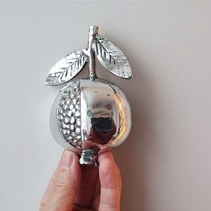 Silver pomegranate sculpture, vintage aluminum pomegranate , half a pomegranate with leaves and seeds showing, greek folk art fruit