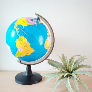 Plastic world globe, decorative vintage globe on movable, rotating axis, cute, colourful world globe