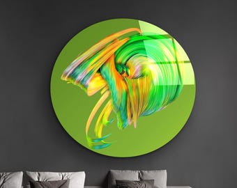 May include: A round, abstract wall art piece with a vibrant design. The artwork features swirling brushstrokes in shades of green, yellow, and orange against a green background. The piece is displayed in a modern living room setting.